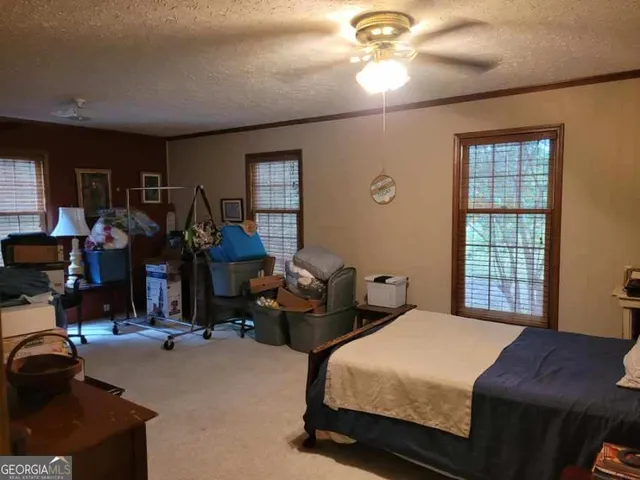 a bathroom with a sink a toilet and a shower