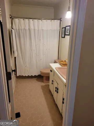 a bedroom with furniture and a large mirror