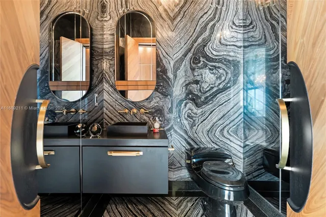 a living room with furniture a rug and a floor to ceiling window