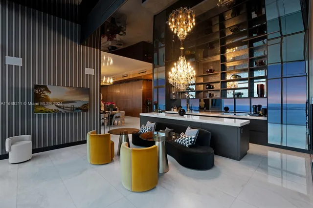 a bedroom with a bed a lamp and a chandelier