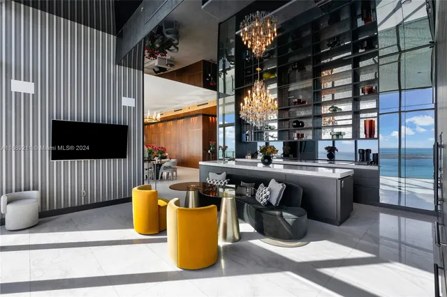 a view of open kitchen with sitting area