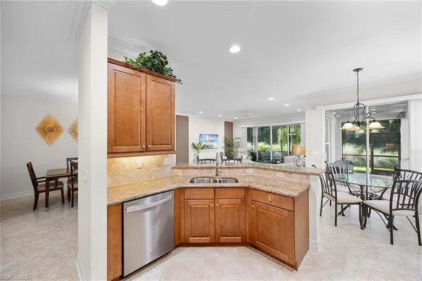 a kitchen with sink cabinets and outdoor view