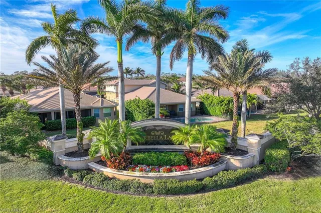 a front view of a house with a garden and a yard