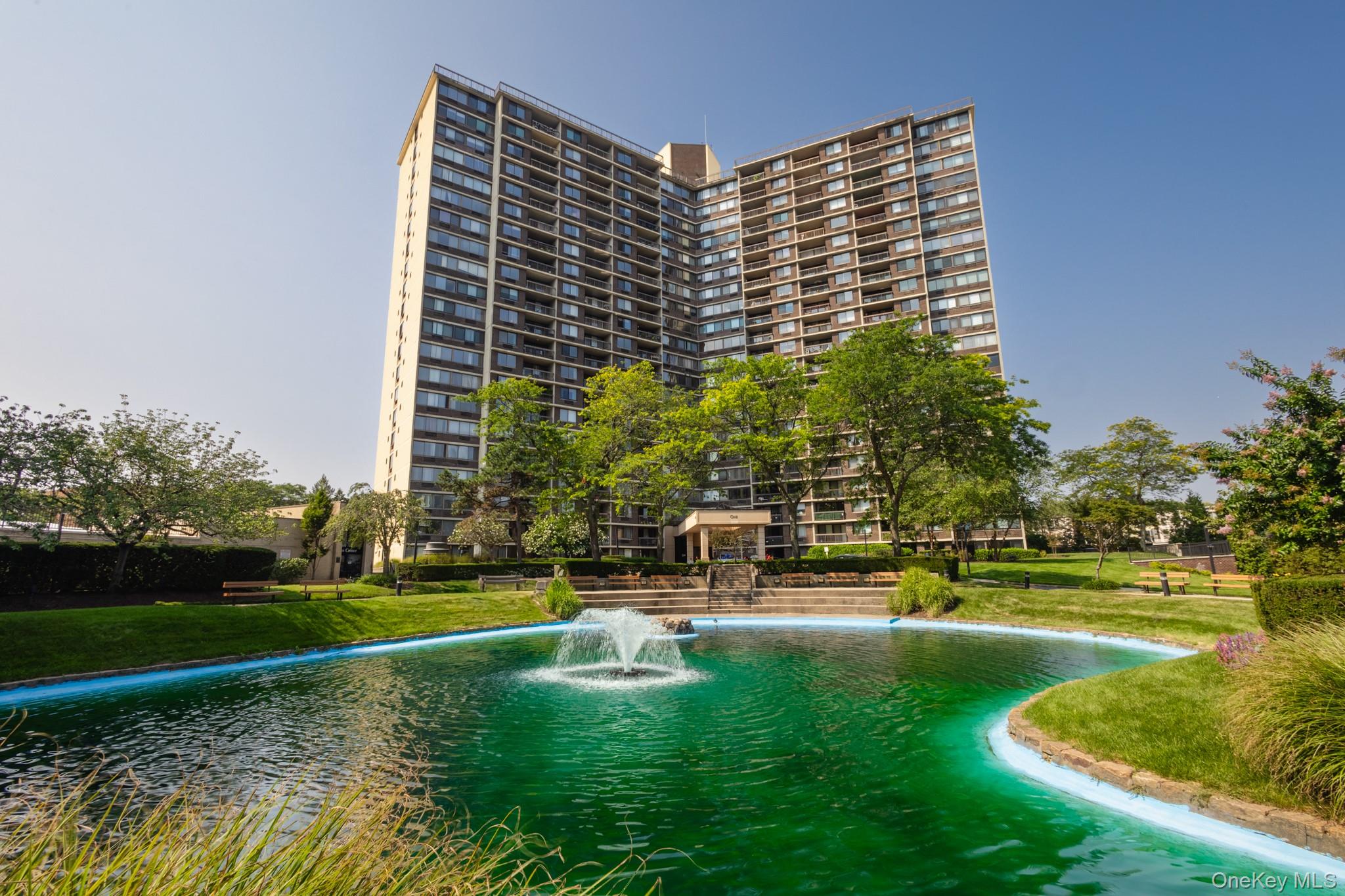 View of pool with a water view