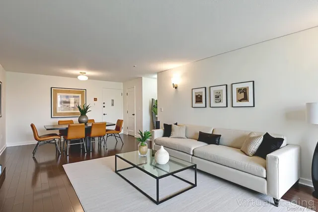a living room with furniture a rug and a window