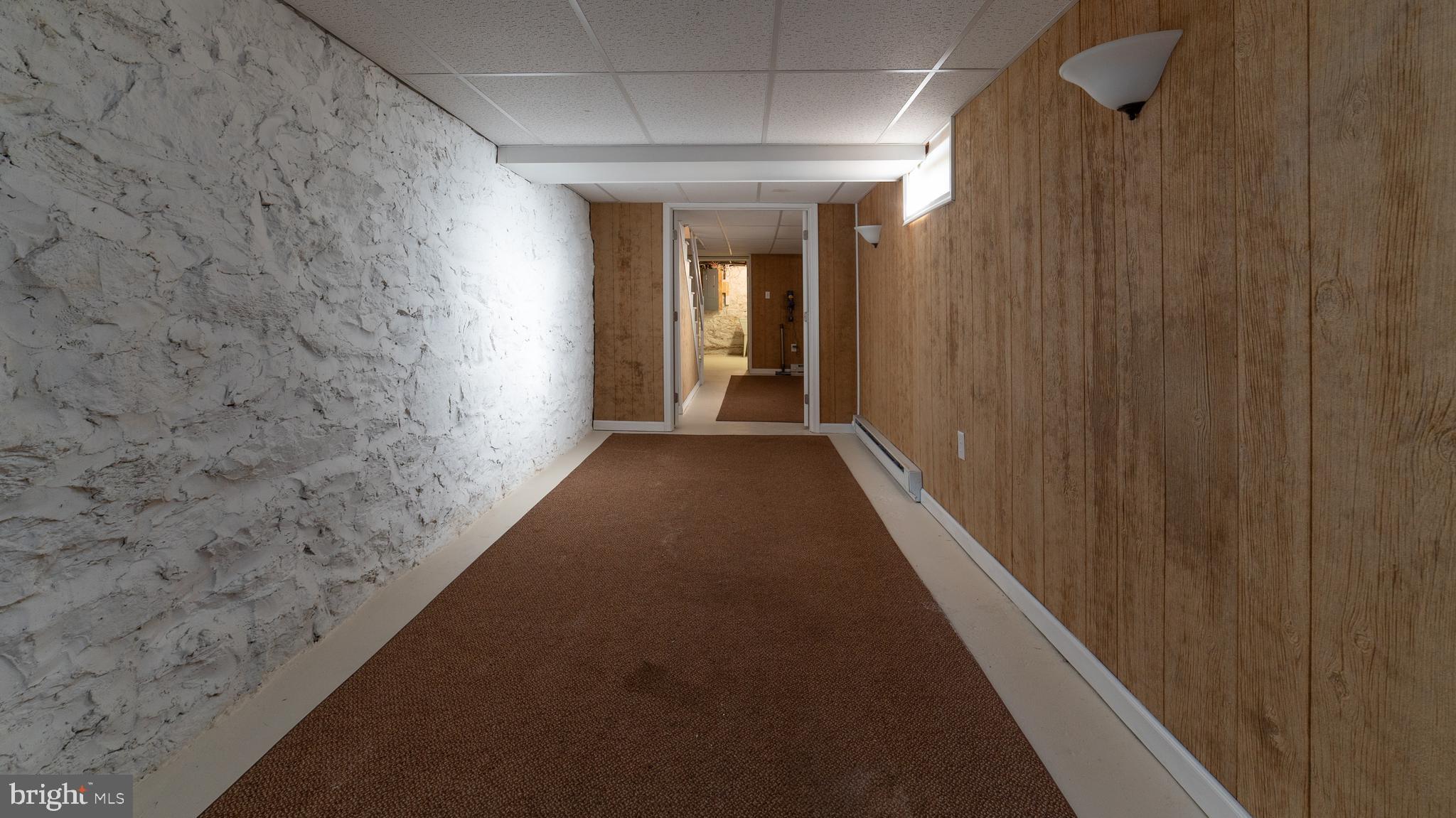19002 Orchard Terrace Road Hagerstown, MD 21742 - Photo 23 of 32 corridor from garage that goes length of basement