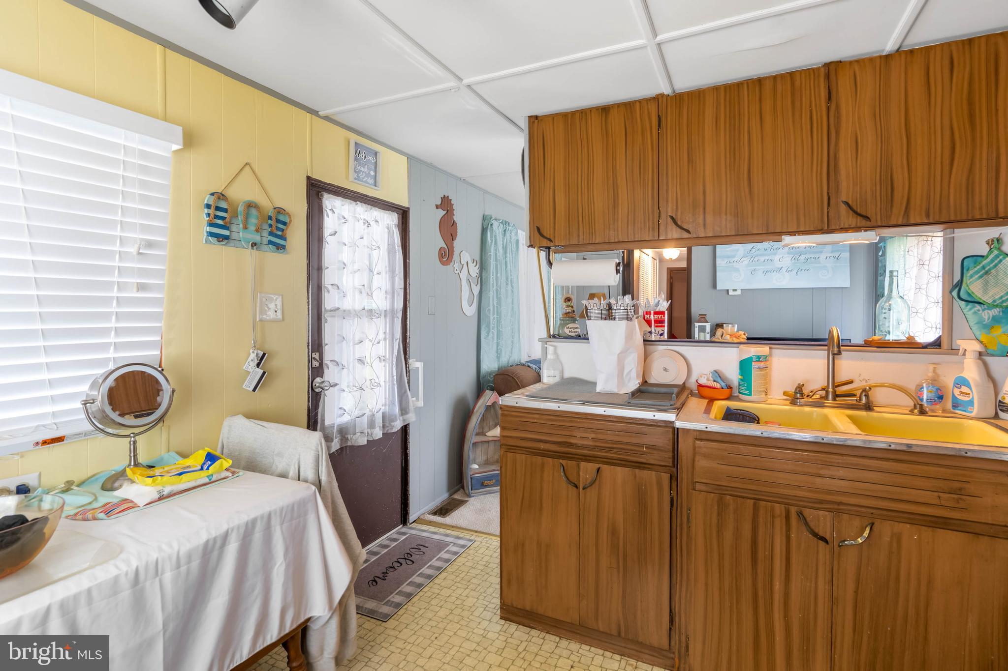 11451 Gum Point Road, Unit 17 Berlin, MD 21811 - Photo 14 of 21 a bedroom with a bed and a table