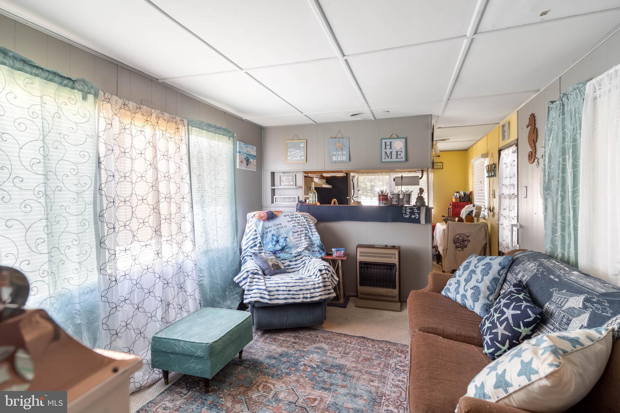 11451 Gum Point Road, Unit 17 Berlin, MD 21811 - Photo 17 of 21 a living room with furniture and a fireplace