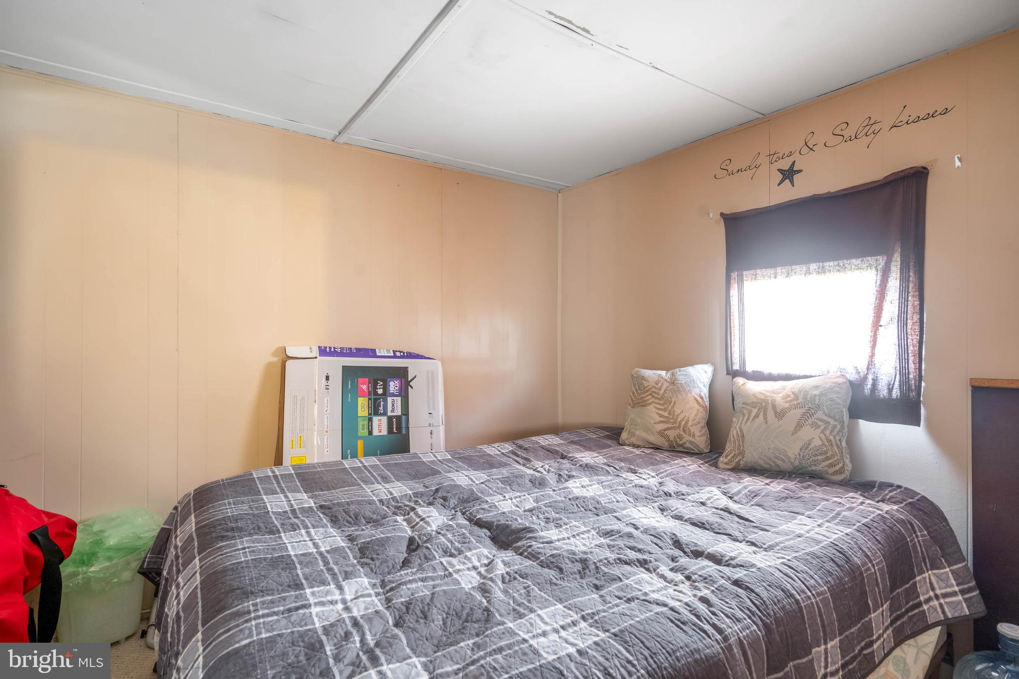 11451 Gum Point Road, Unit 17 Berlin, MD 21811 - Photo 21 of 21 a bedroom with a bed and a mirror