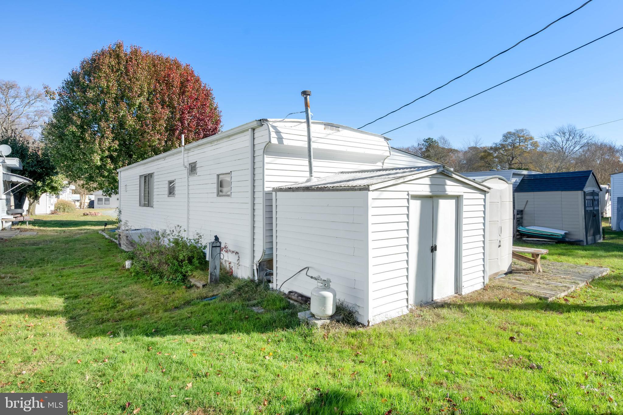 11451 Gum Point Road, Unit 17 Berlin, MD 21811 - Photo 5 of 21 a view of a house with backyard
