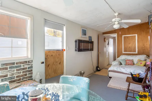 a bedroom with a bed furniture and a window