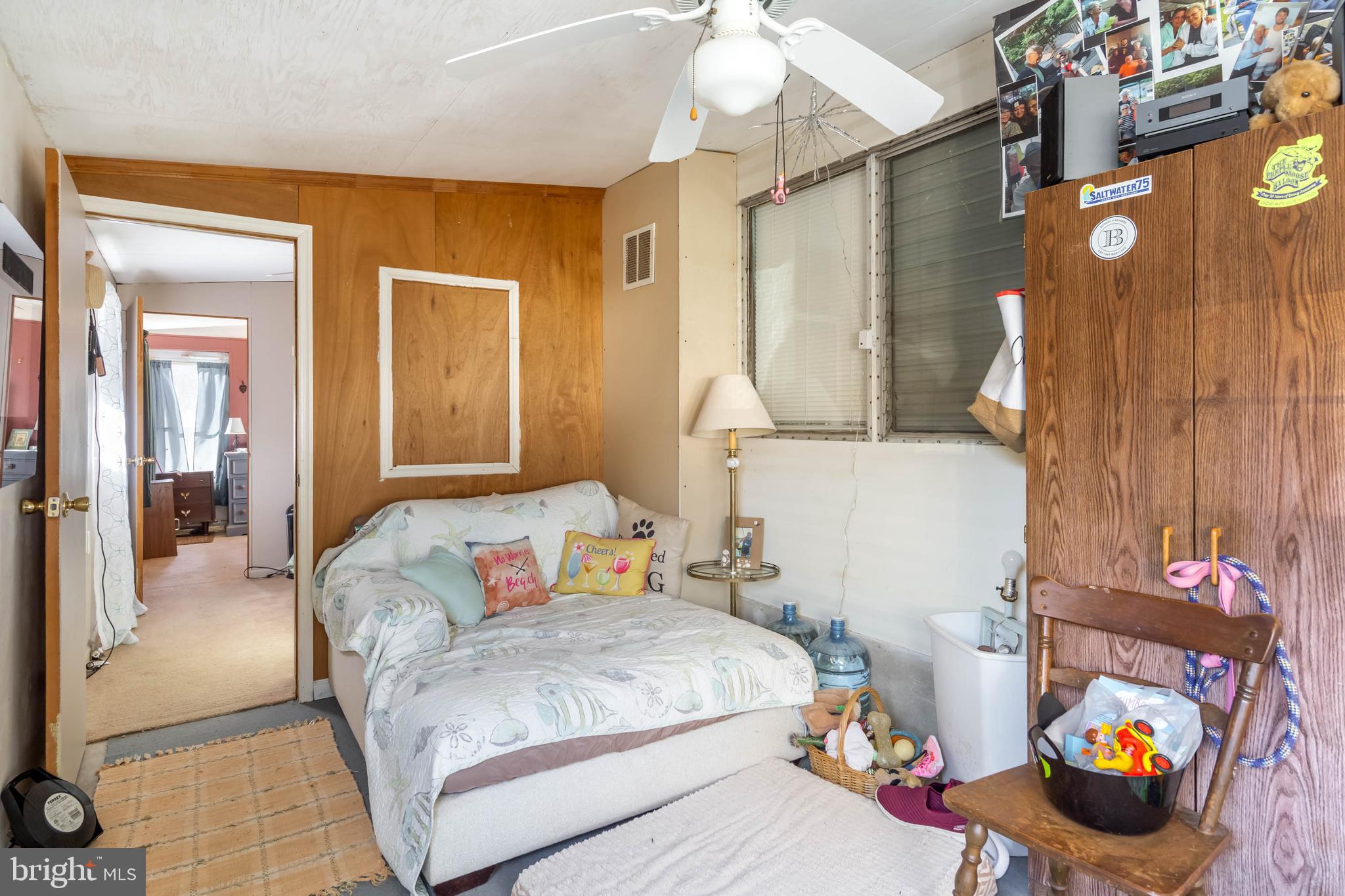 11451 Gum Point Road, Unit 17 Berlin, MD 21811 - Photo 8 of 21 a bedroom with a bed and a couch