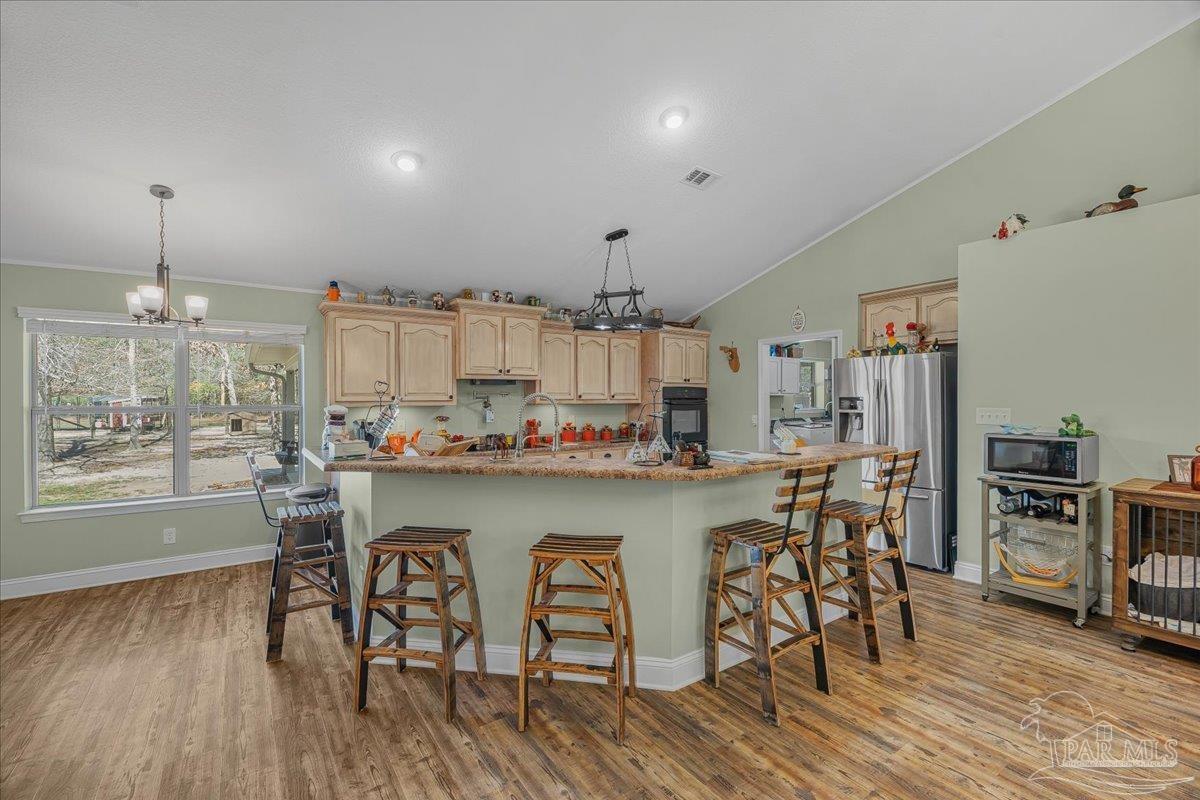 1766 Narrow Road Jay, FL 32565 - Photo 14 of 55 a kitchen with a table and chairs in it