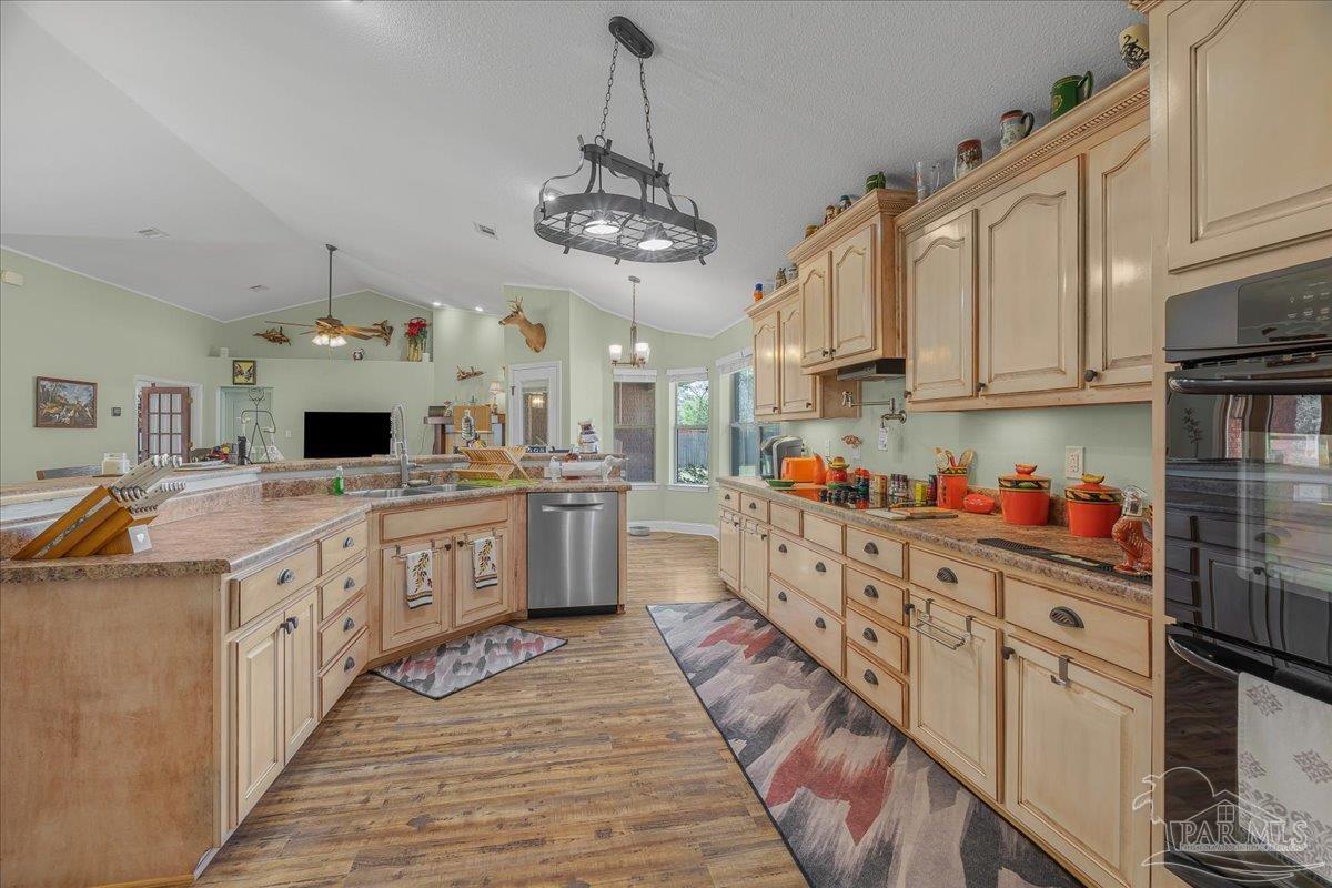 1766 Narrow Road Jay, FL 32565 - Photo 15 of 55 a large kitchen with stainless steel appliances granite countertop a stove and a sink