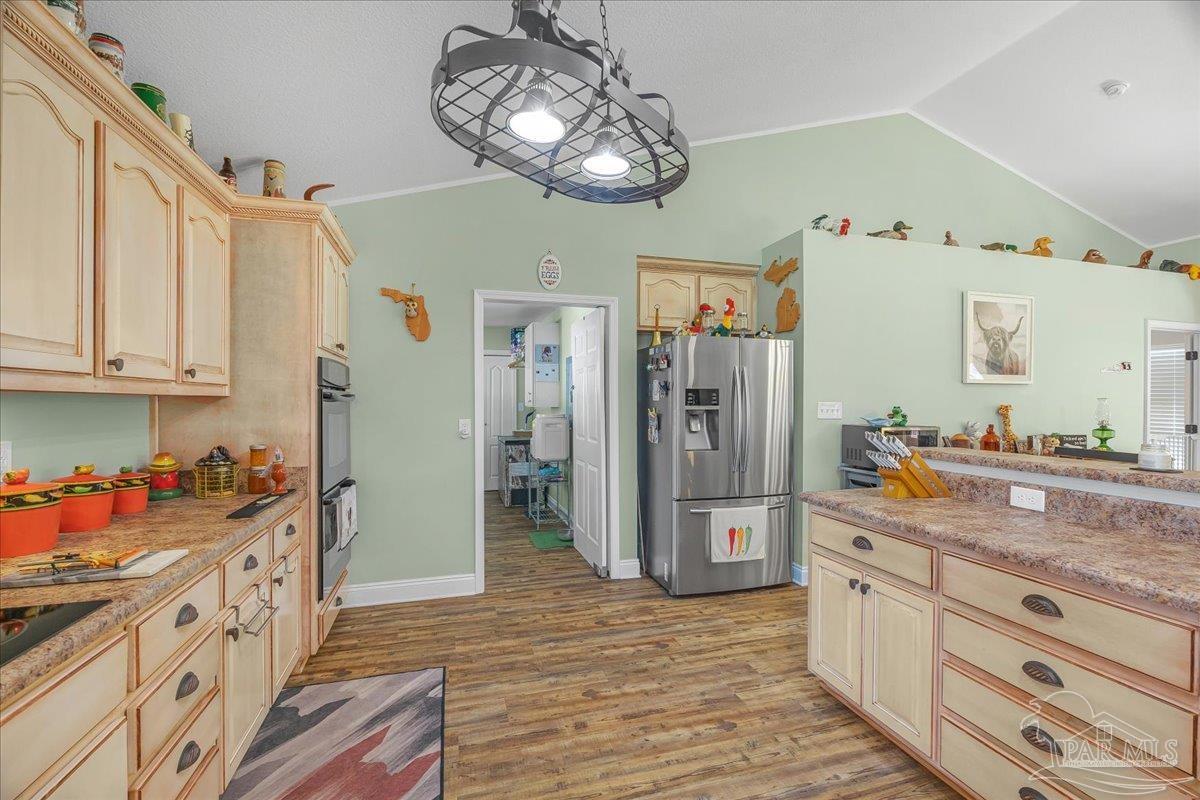 1766 Narrow Road Jay, FL 32565 - Photo 17 of 55 a kitchen with stainless steel appliances granite countertop a refrigerator and stove top oven