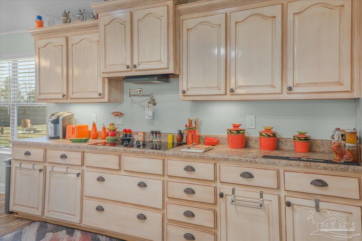 1766 Narrow Road Jay, FL 32565 - Photo 19 of 55 a kitchen with white cabinets and white appliances