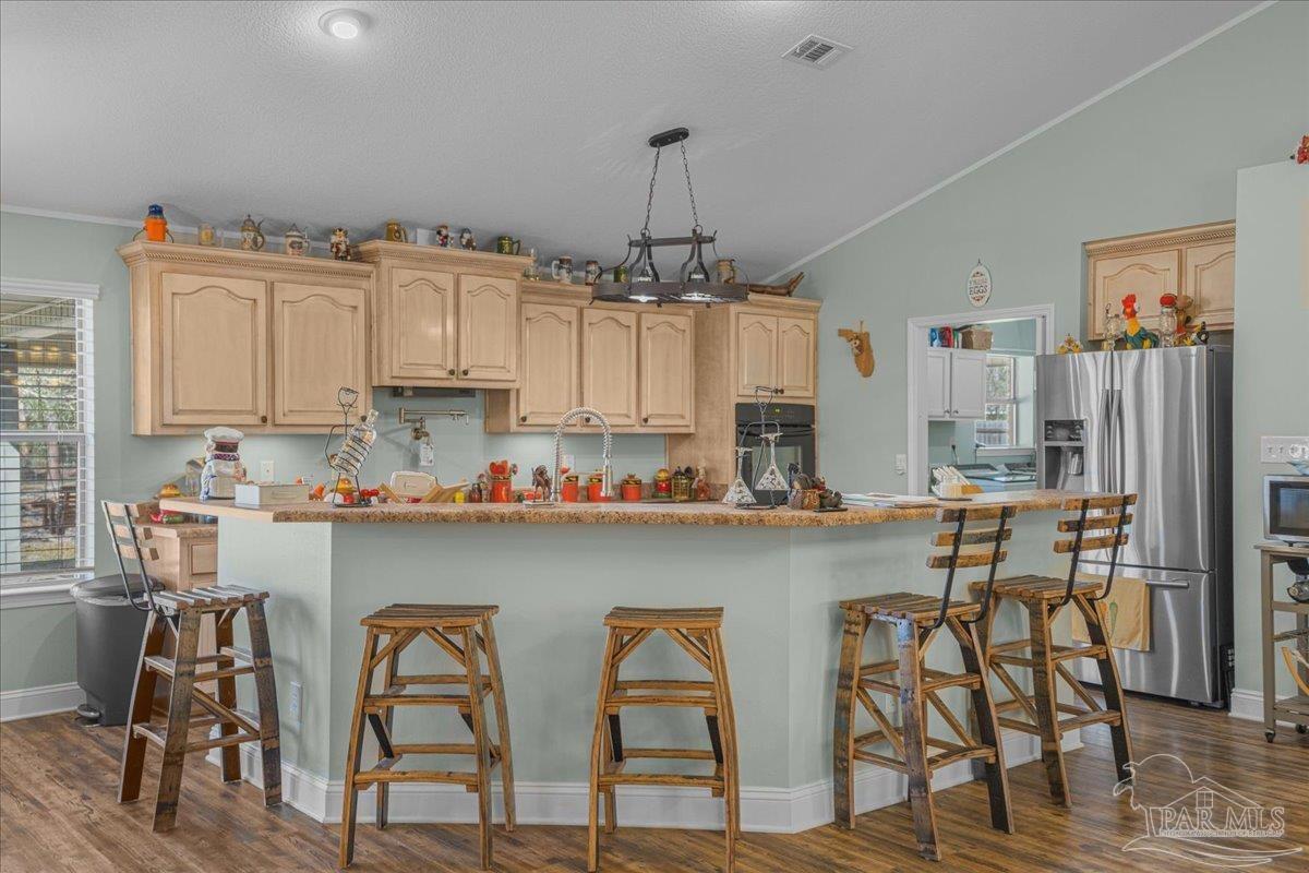 1766 Narrow Road Jay, FL 32565 - Photo 20 of 55 a kitchen with stainless steel appliances a table and chairs in it