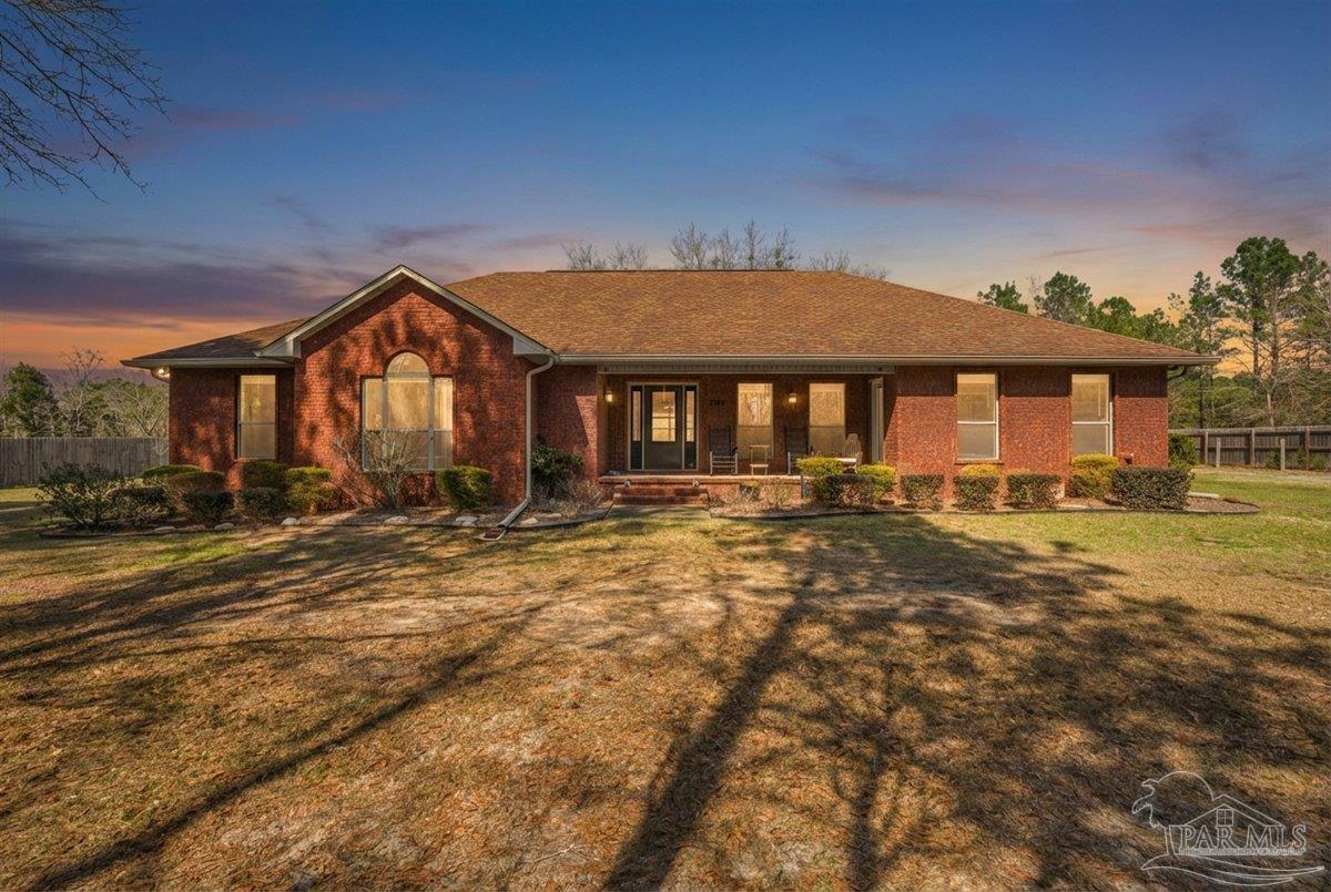1766 Narrow Road Jay, FL 32565 - Photo 2 of 55 a front view of a house with a yard