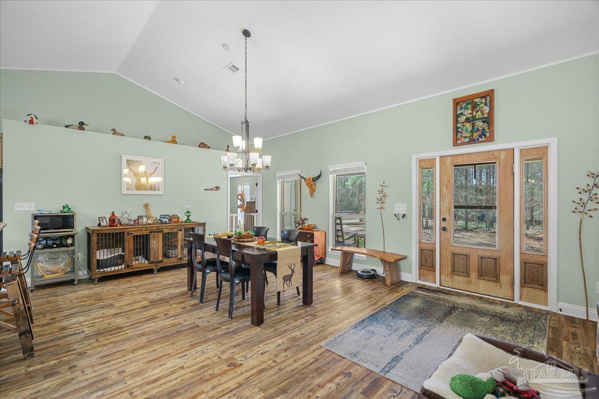 1766 Narrow Road Jay, FL 32565 - Photo 22 of 55 a view of a dining room with furniture window and wooden floor