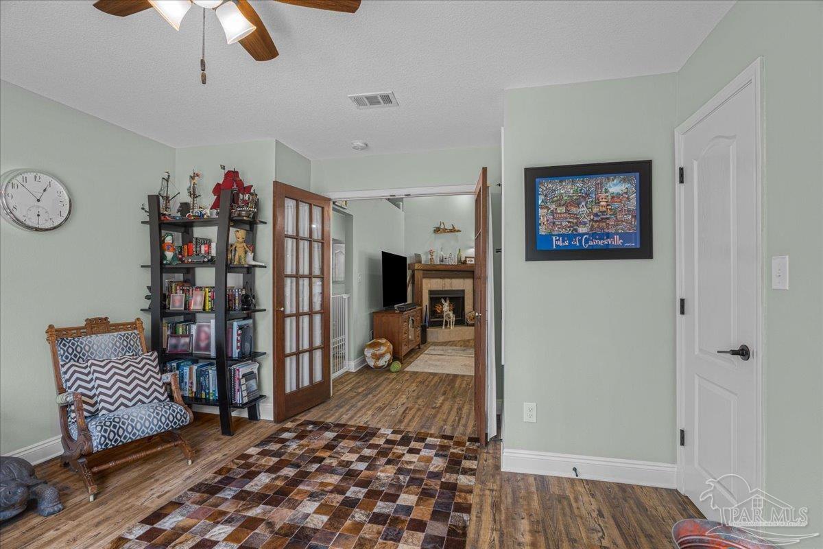 1766 Narrow Road Jay, FL 32565 - Photo 29 of 55 a bedroom with furniture and wooden floor