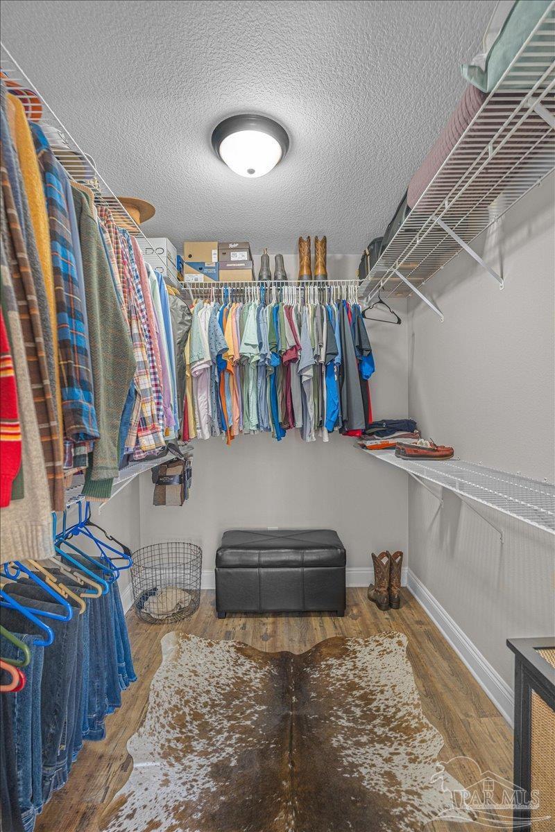 1766 Narrow Road Jay, FL 32565 - Photo 36 of 55 a view of walk in closet with clothes and shoes