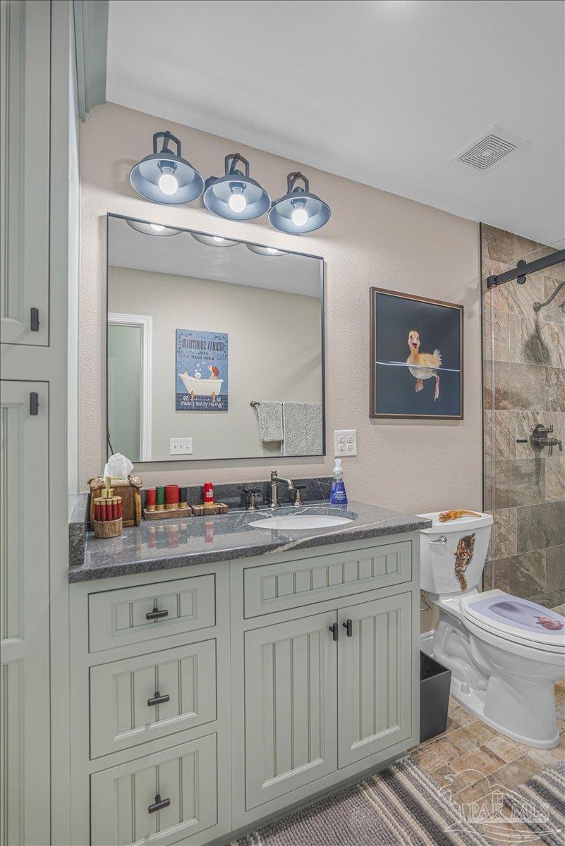 1766 Narrow Road Jay, FL 32565 - Photo 45 of 55 a bathroom with a double vanity sink and a mirror