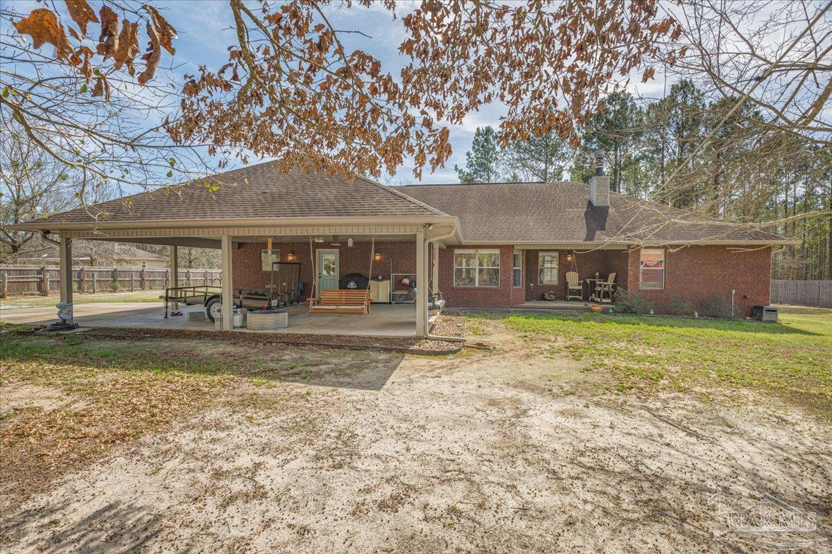 1766 Narrow Road Jay, FL 32565 - Photo 46 of 55 a front view of a house with a garden