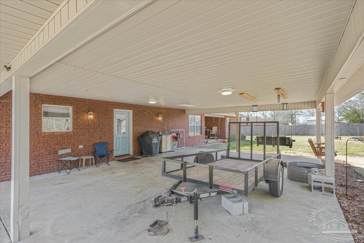 1766 Narrow Road Jay, FL 32565 - Photo 47 of 55 a room with lots of tables a large window and chairs