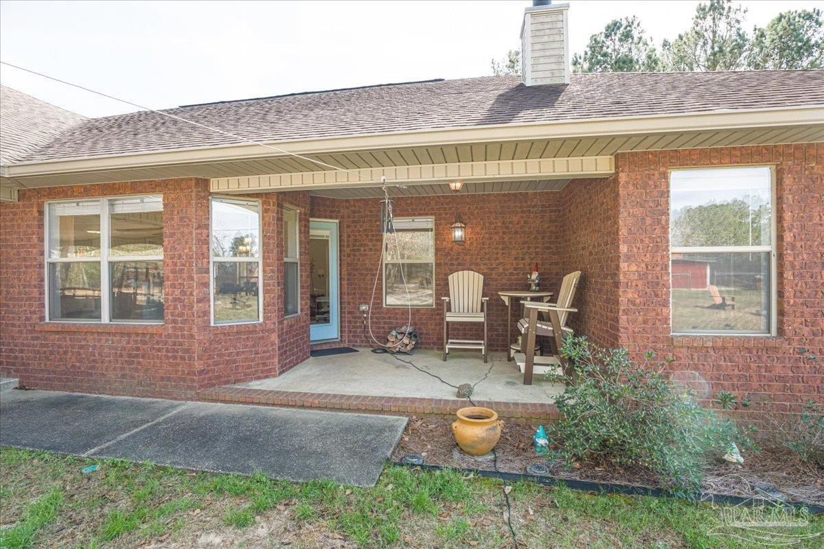 1766 Narrow Road Jay, FL 32565 - Photo 48 of 55 a backyard of a house with outdoor seating