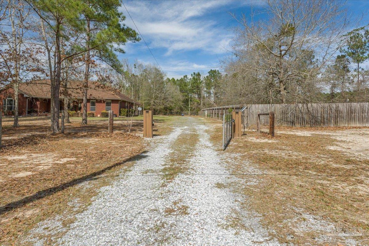 1766 Narrow Road Jay, FL 32565 - Photo 5 of 55 a view of yard with wooden fence