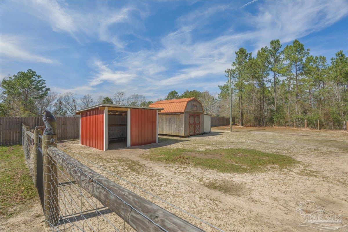 1766 Narrow Road Jay, FL 32565 - Photo 51 of 55 a backyard of a house with large trees