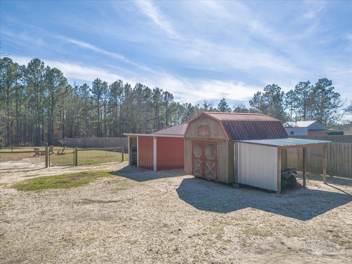 1766 Narrow Road Jay, FL 32565 - Photo 52 of 55 a view of a backyard with swimming pool