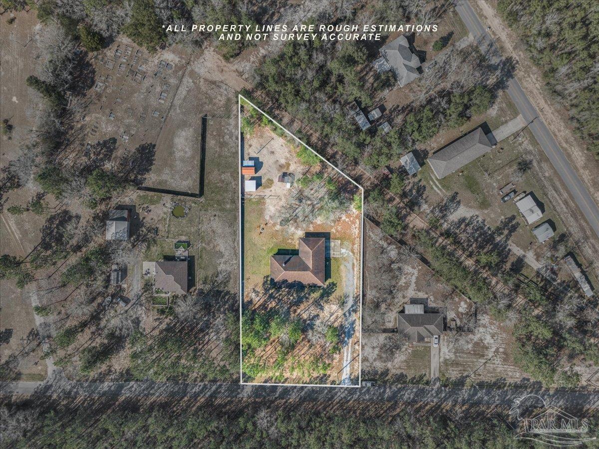 1766 Narrow Road Jay, FL 32565 - Photo 8 of 55 a backyard of a house with lots of green space