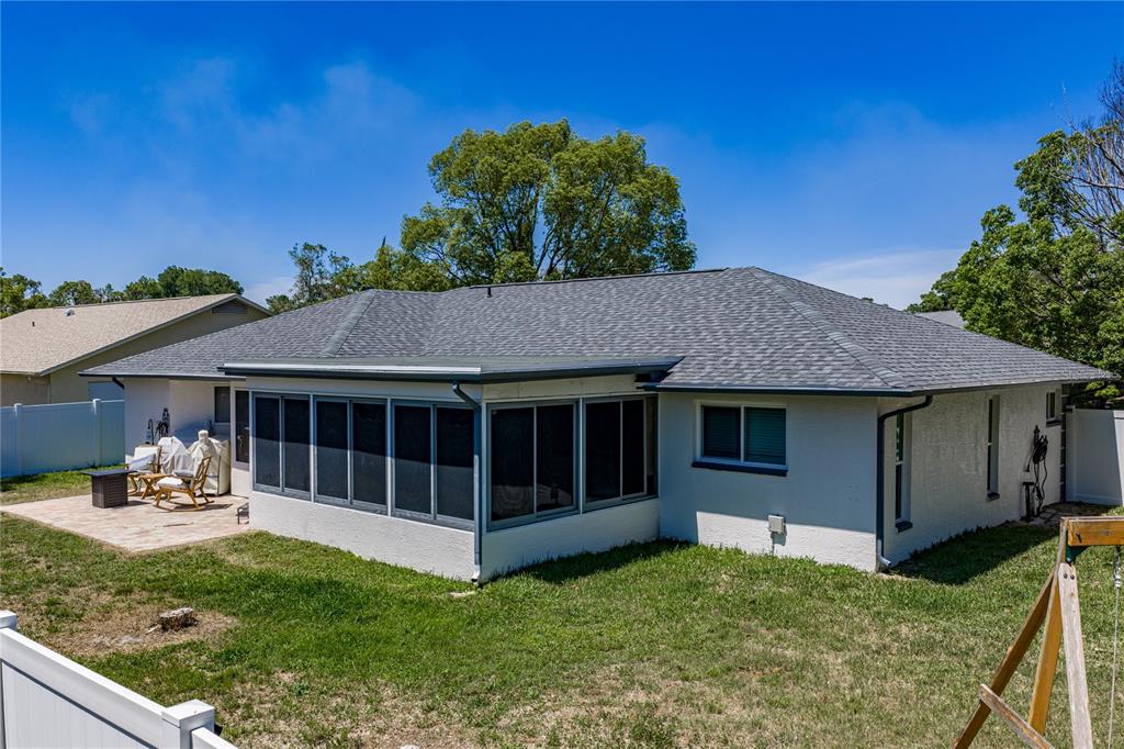 7435 Kilbride Court Weeki Wachee, FL 34613 - Photo 45 of 67 a view of a house with a yard and furniture