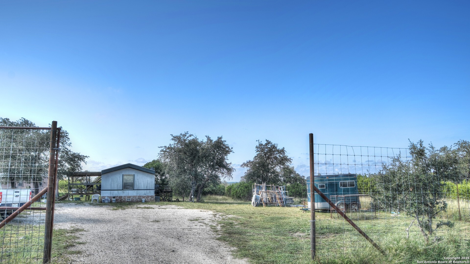 14832 Highway 41 Rocksprings, TX 78880 - Photo 11 of 21 a view of a big yard in front of a house