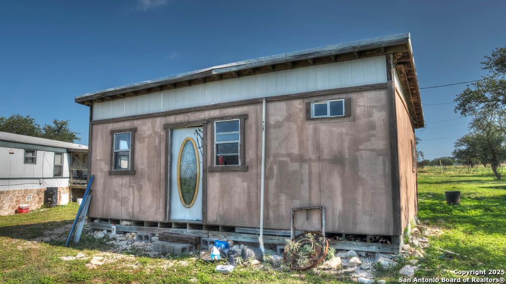 14832 Highway 41 Rocksprings, TX 78880 - Photo 12 of 21 a view of a small house with yard