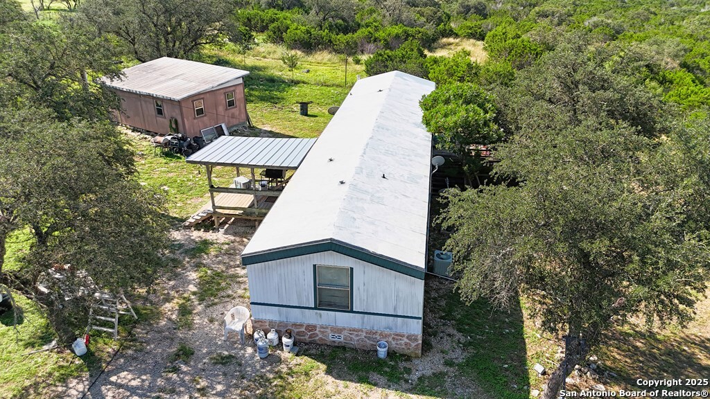 14832 Highway 41 Rocksprings, TX 78880 - Photo 14 of 21 a view of a house with a backyard