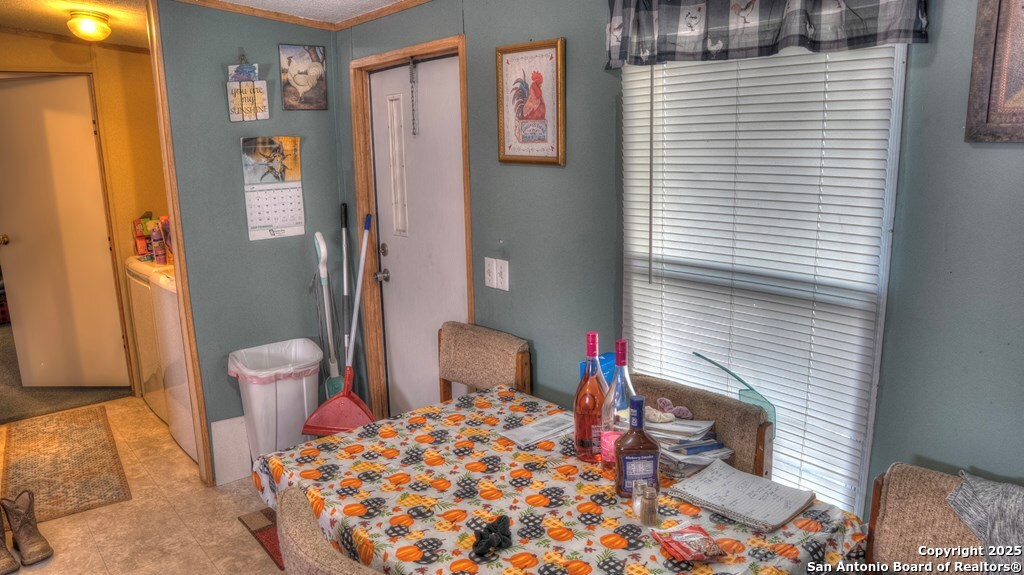 14832 Highway 41 Rocksprings, TX 78880 - Photo 6 of 21 a bedroom with a bed and a table in it