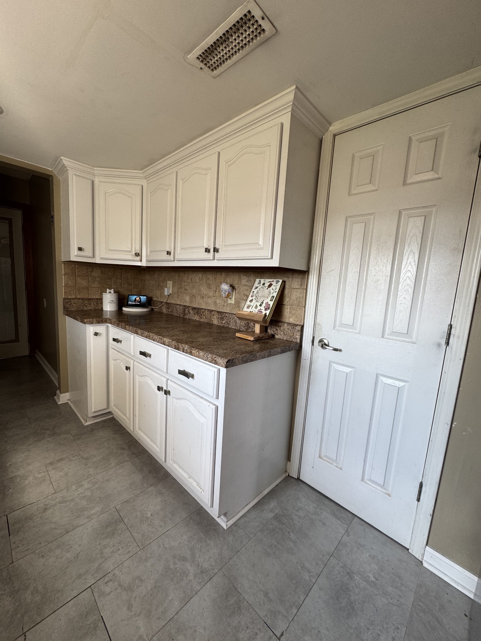 57 East Crystal Springs Road Kelso, TN 37348 - Photo 20 of 28 a kitchen with granite countertop white cabinets and white appliances
