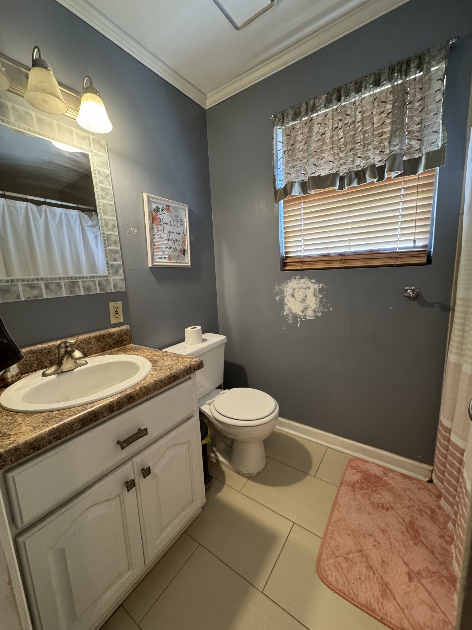 57 East Crystal Springs Road Kelso, TN 37348 - Photo 23 of 28 a bathroom with a sink a toilet and mirror