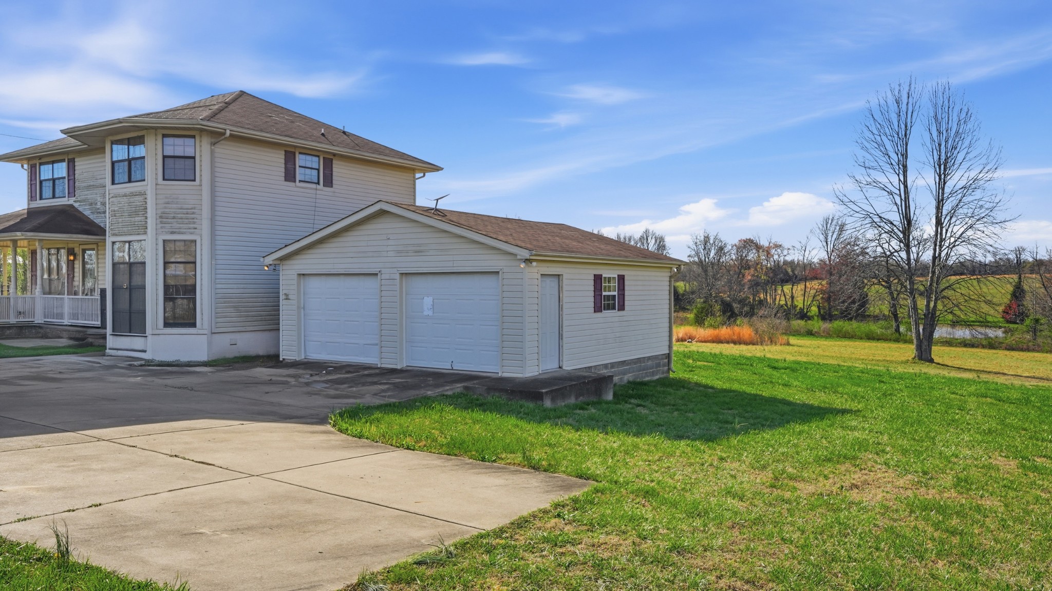 57 East Crystal Springs Road Kelso, TN 37348 - Photo 6 of 28 a front view of a house with a yard and garage