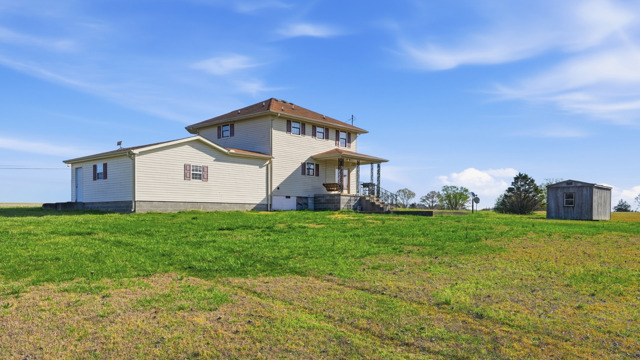 57 East Crystal Springs Road Kelso, TN 37348 - Photo 10 of 28 a front view of a house with garden