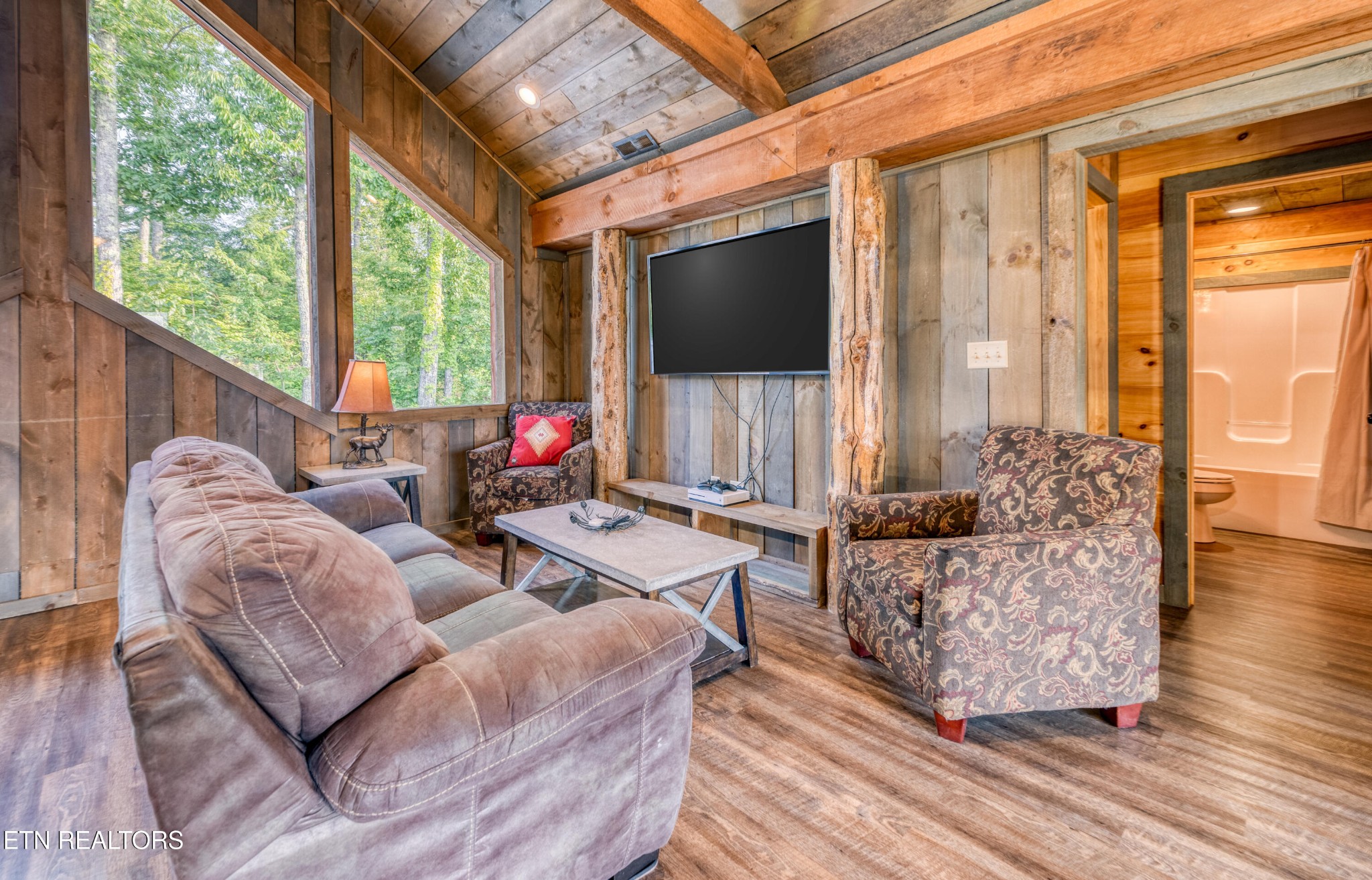 809 Pinecrest Way Sevierville, TN 37862 - Photo 36 of 60 a living room with furniture fireplace and a large window