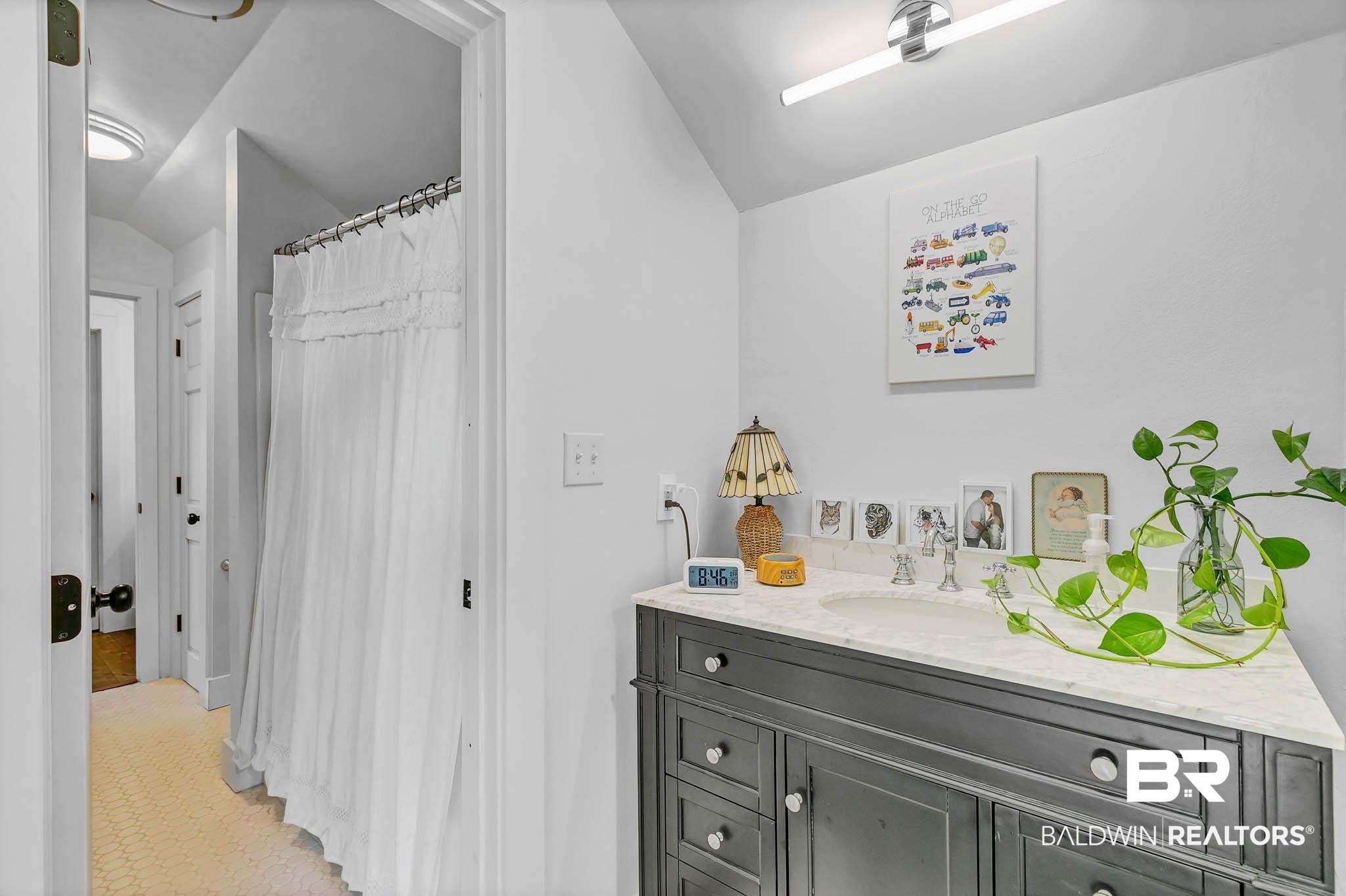 7564 Rabbit Run Road Fairhope, AL 36532 - Photo 46 of 88 Full bathroom with vaulted ceiling, vanity, and a shower with curtain