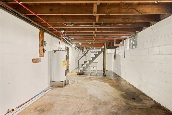 a view of empty room with wooden walls