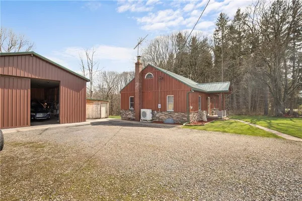 a view of a house with a yard and garage