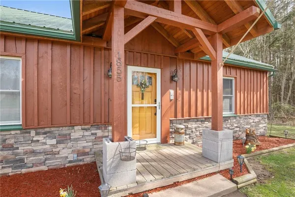 a view of house with backyard and outdoor seating