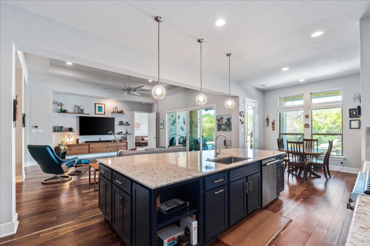 413 Montalcino Lane Georgetown, TX 78628 - Photo 14 of 40 a large kitchen with lots of counter space dining table and a large window