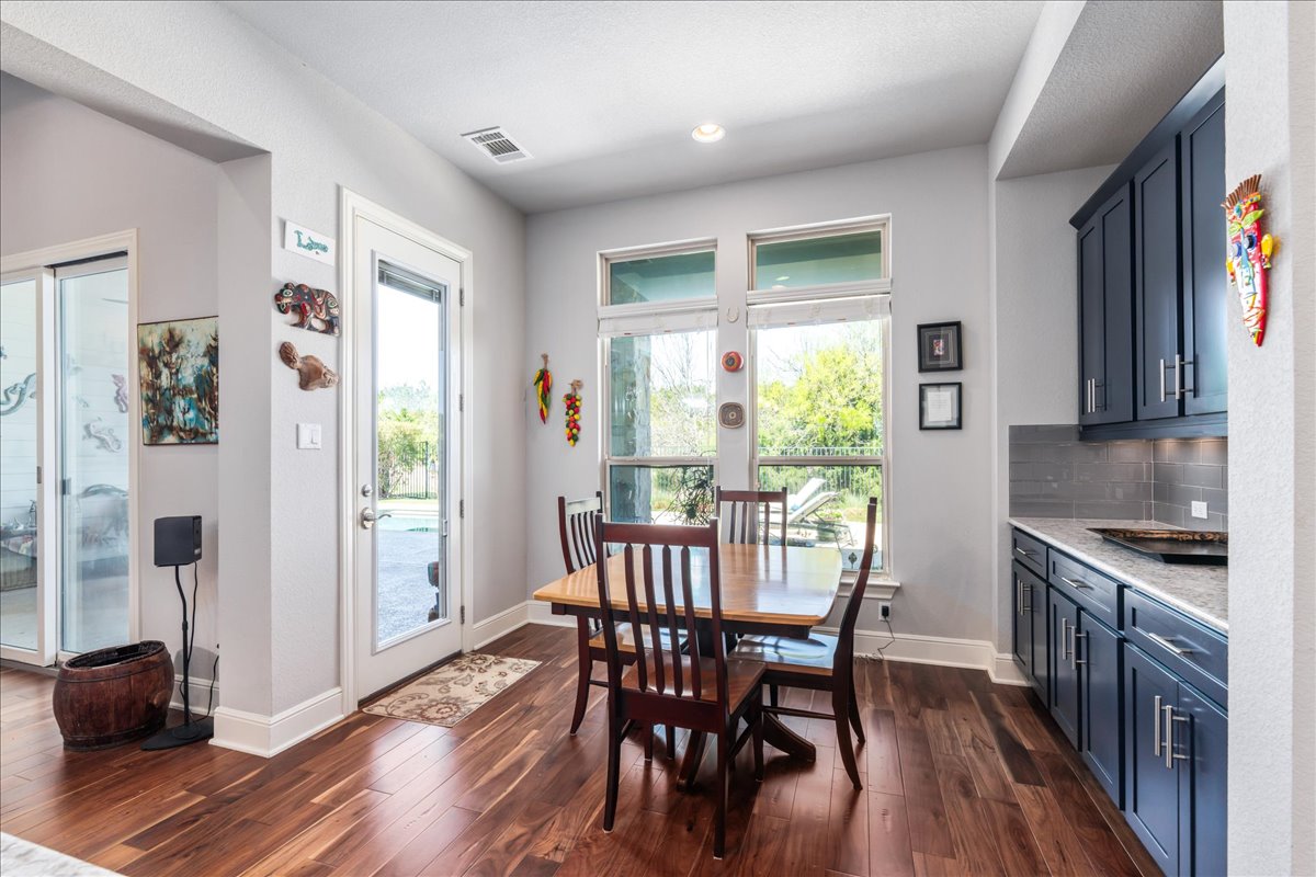 413 Montalcino Lane Georgetown, TX 78628 - Photo 16 of 40 a view of a dining room with furniture window and wooden floor