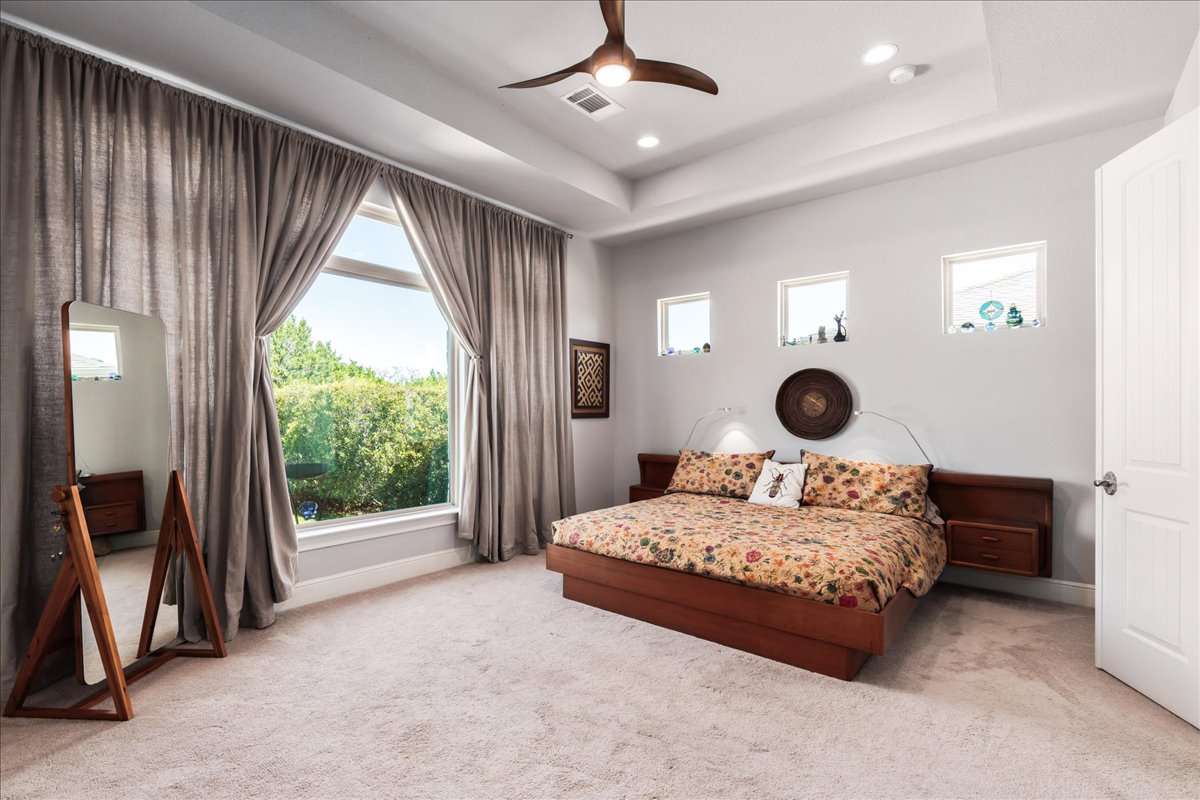 413 Montalcino Lane Georgetown, TX 78628 - Photo 21 of 40 a bedroom with a bed and a window